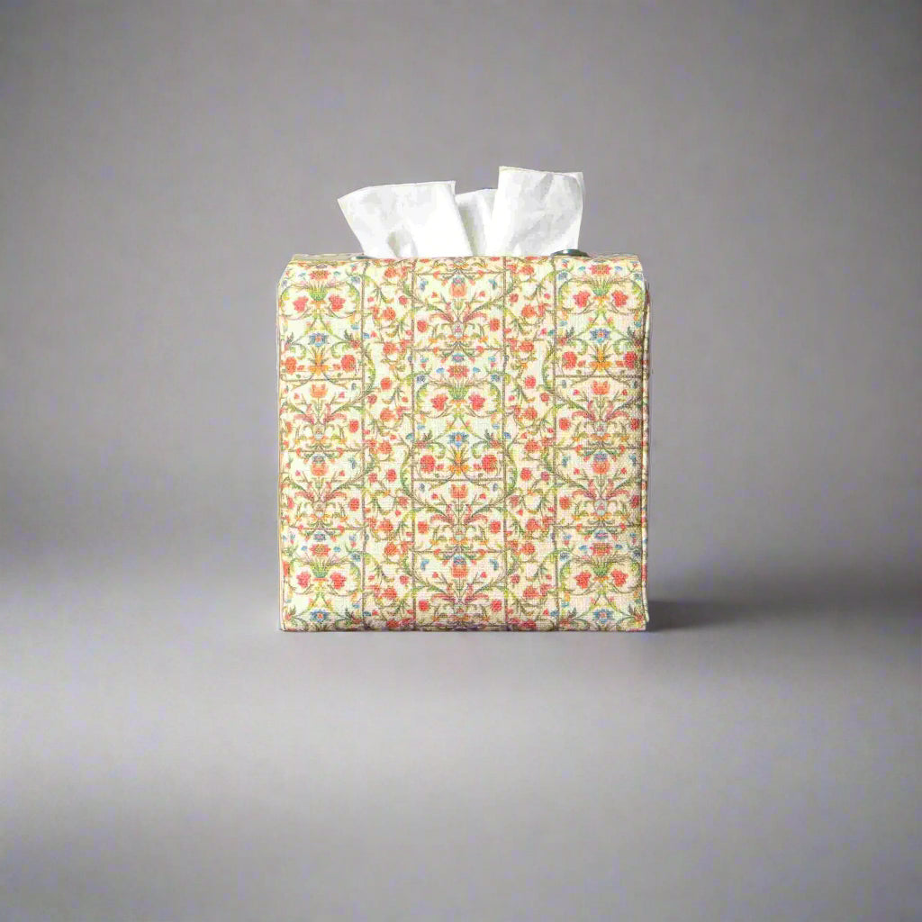 Linen square tissue box cover with winding green vines and red and blue blossoms