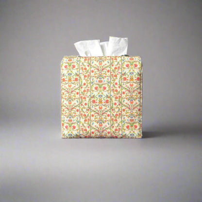 Linen square tissue box cover with winding green vines and red and blue blossoms
