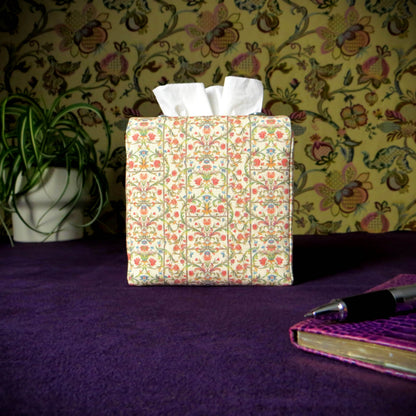 Linen square tissue box cover with pen, notebook, and plant