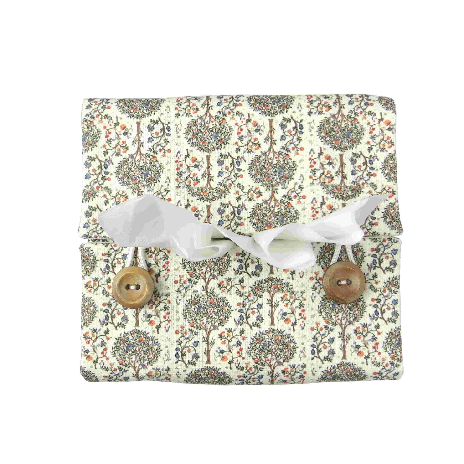 Linen square tissue box cover with a mini orchard grove pattern