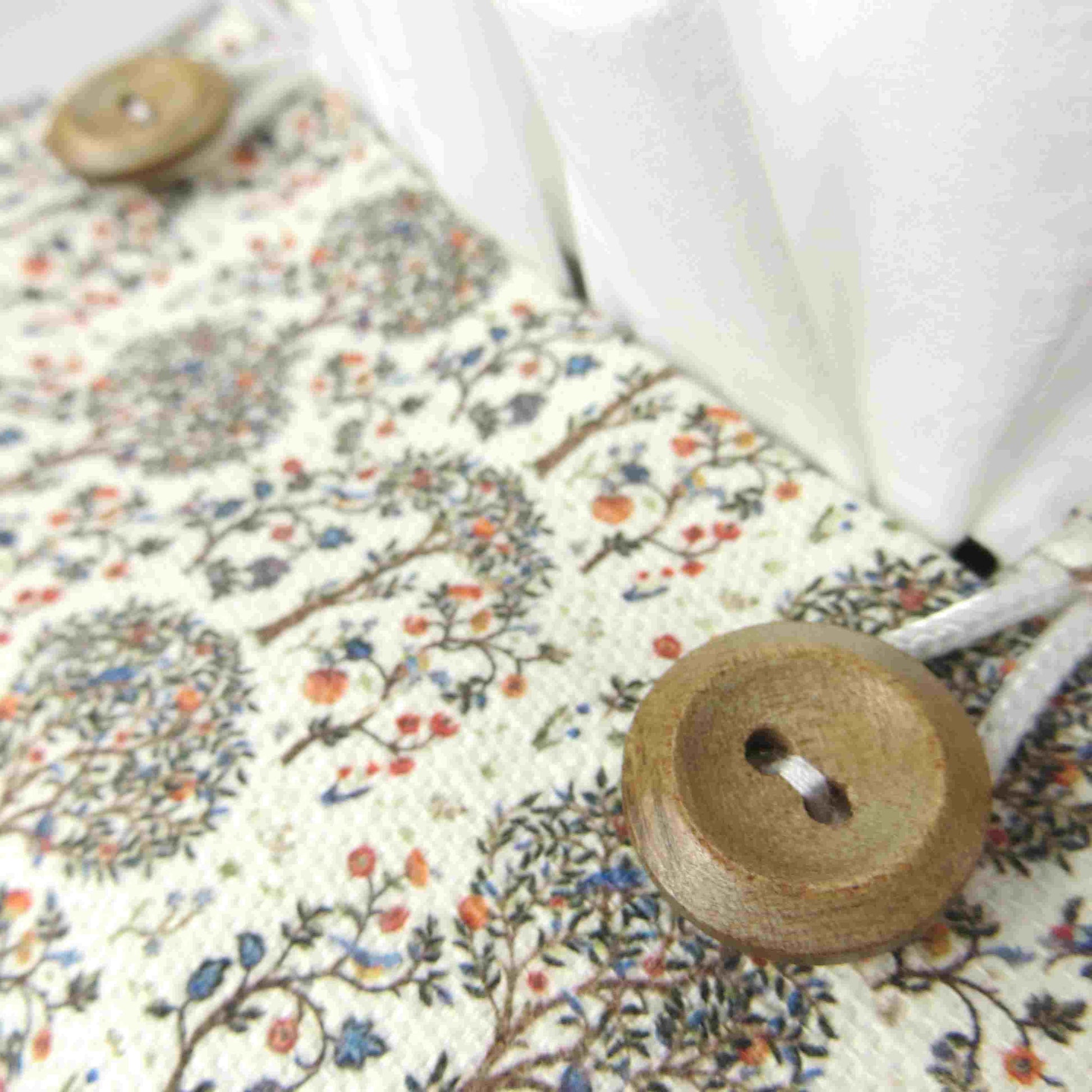 Linen square tissue box cover with a mini orchard grove pattern