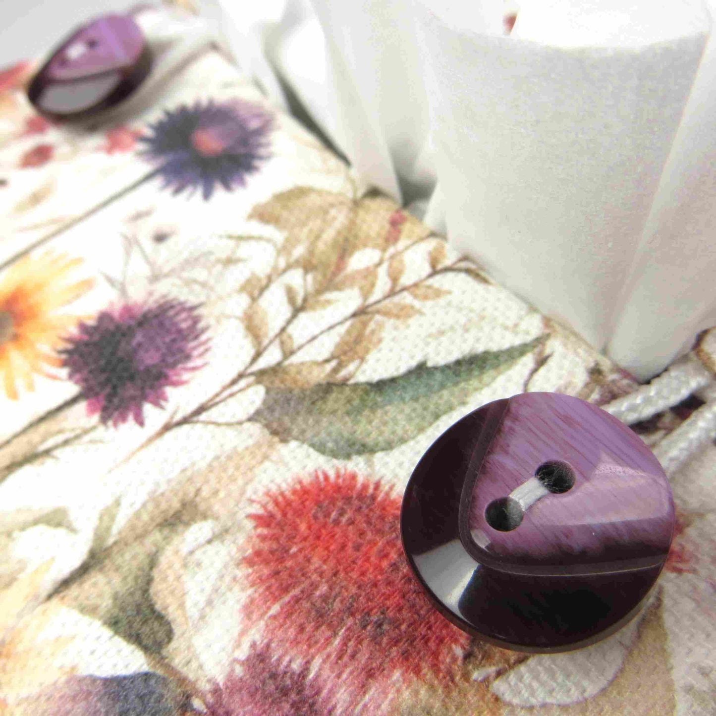 Linen square tissue box cover with  colourful wildflowers in a watercolour-style design