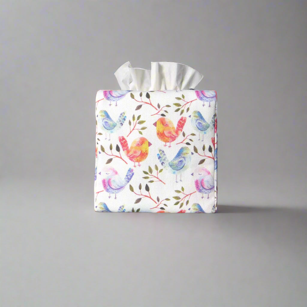 Cotton square tissue box cover with watercolour style blue, purple, and orange birds on white background