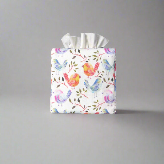 Cotton square tissue box cover with watercolour style blue, purple, and orange birds on white background