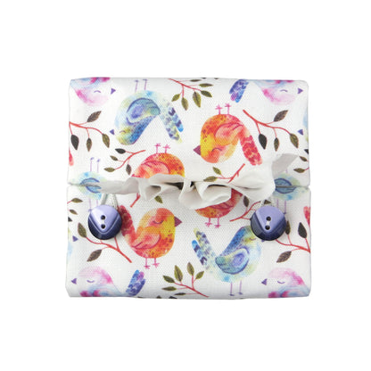 Cotton square tissue box cover with watercolour style blue, purple, and orange birds on white background