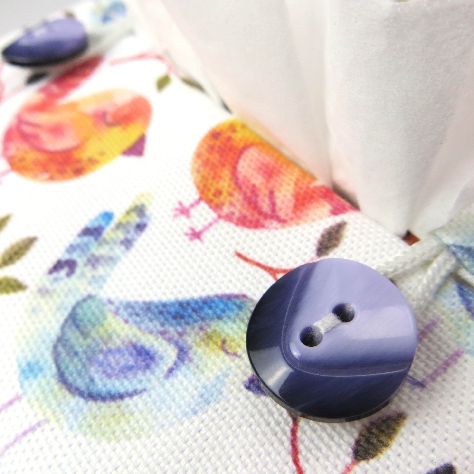 Cotton square tissue box cover with watercolour style blue, purple, and orange birds on white background