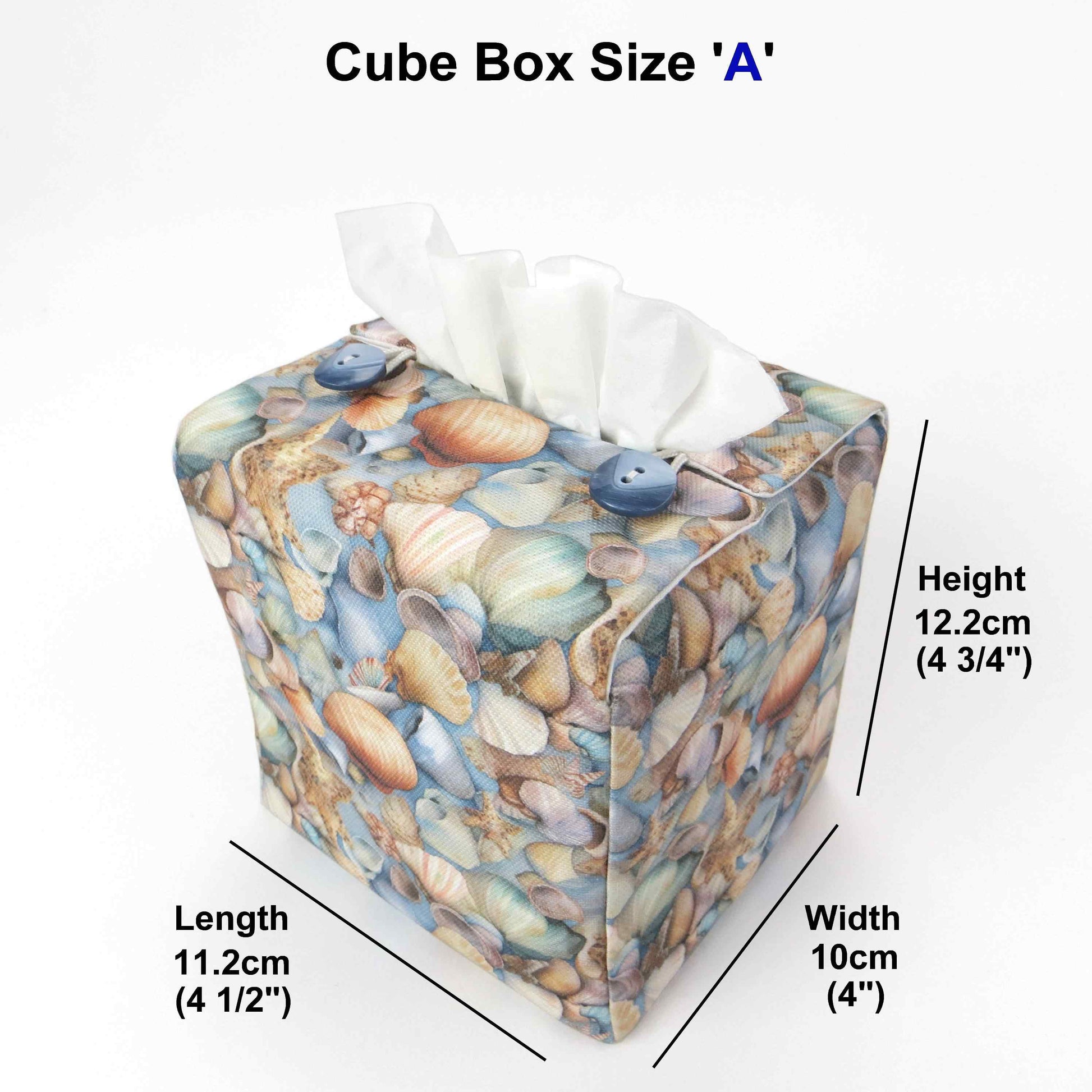 Cotton square tissue box cover with soft pastel seashell images set against a light blue background