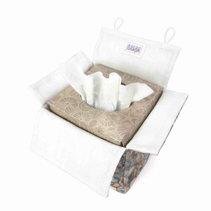 Cotton square tissue box cover with soft pastel seashell images set against a light blue background