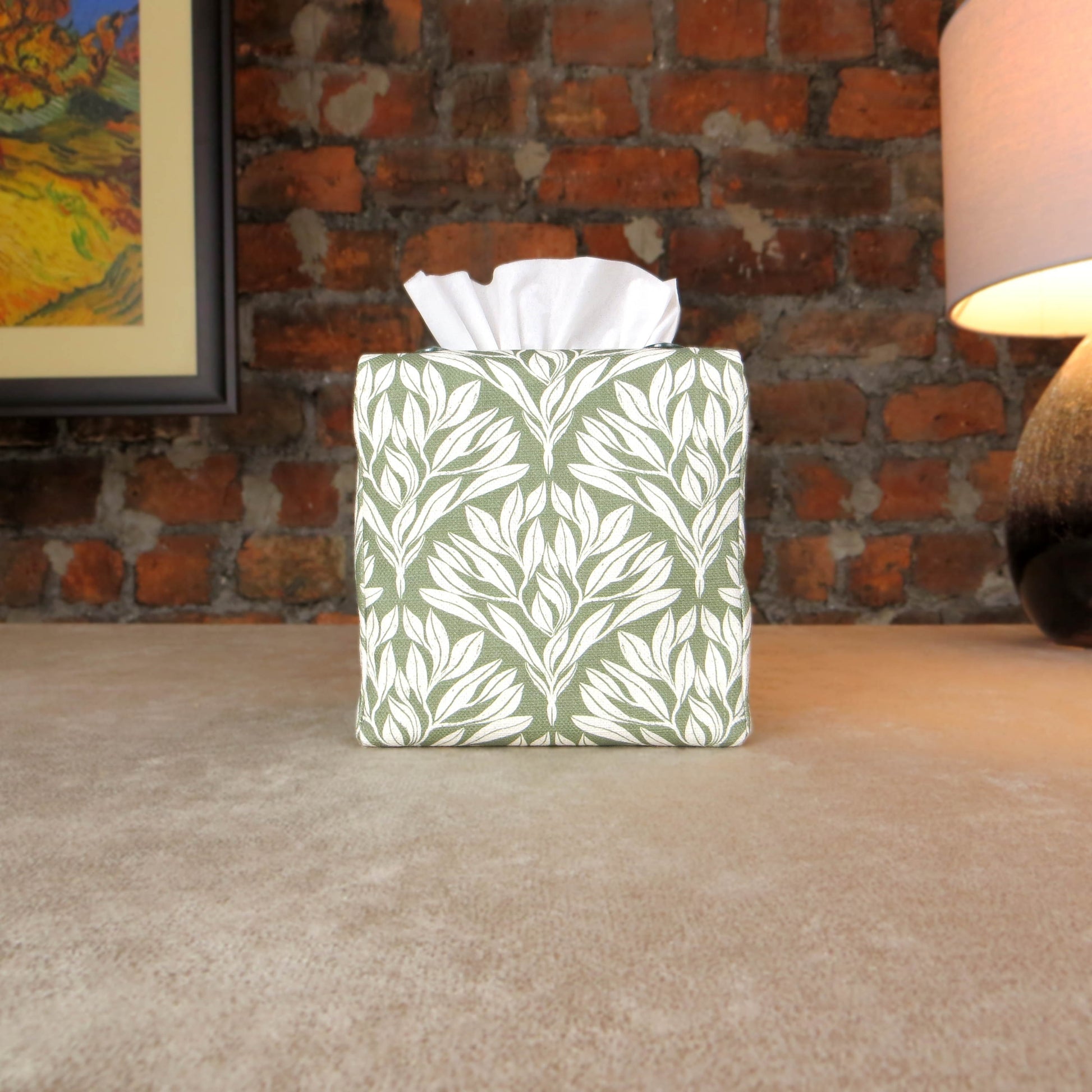 Linen square tissue box cover with an off-white leaf pattern on a sage green background
