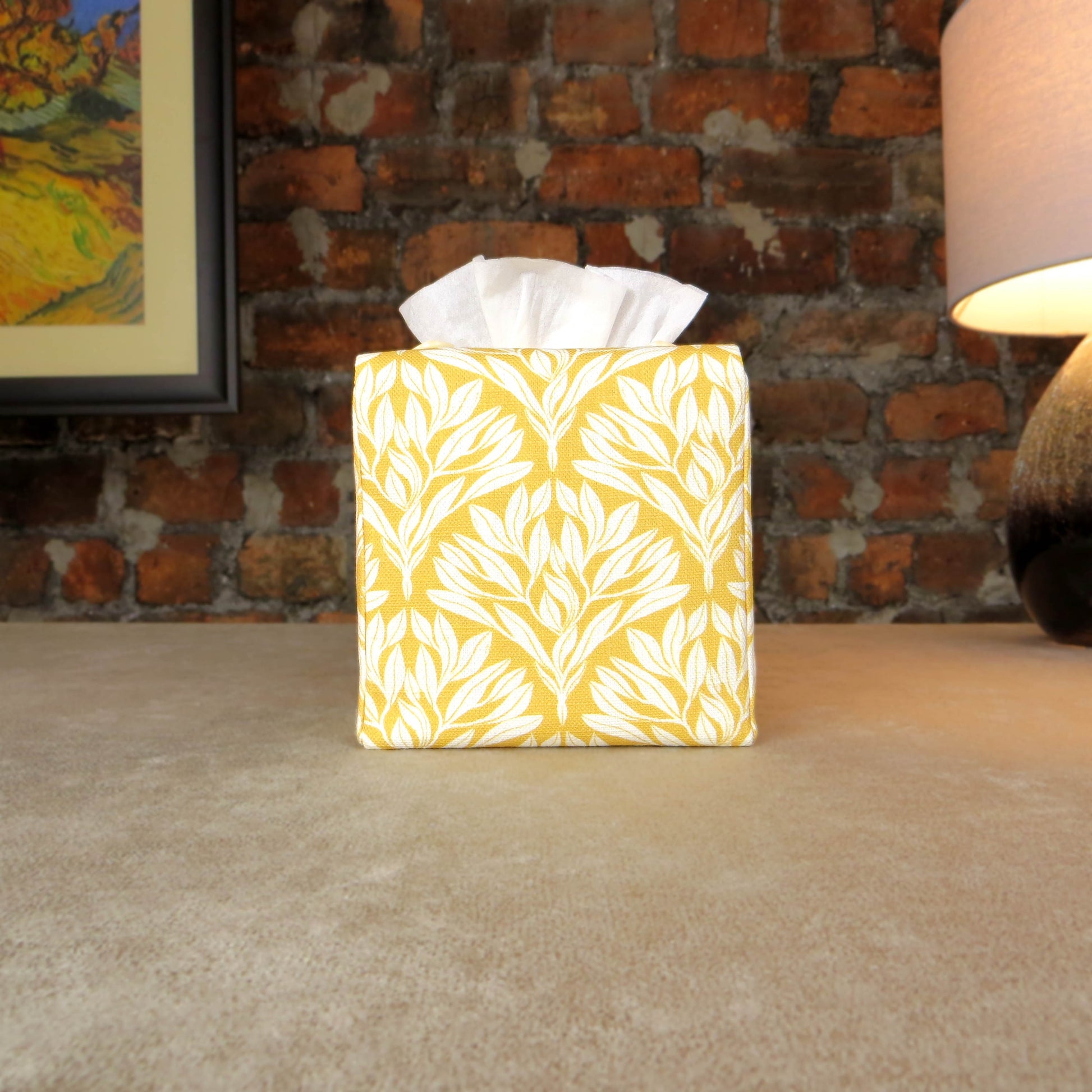 Linen square tissue box cover with an off-white leaf design on a yellow background