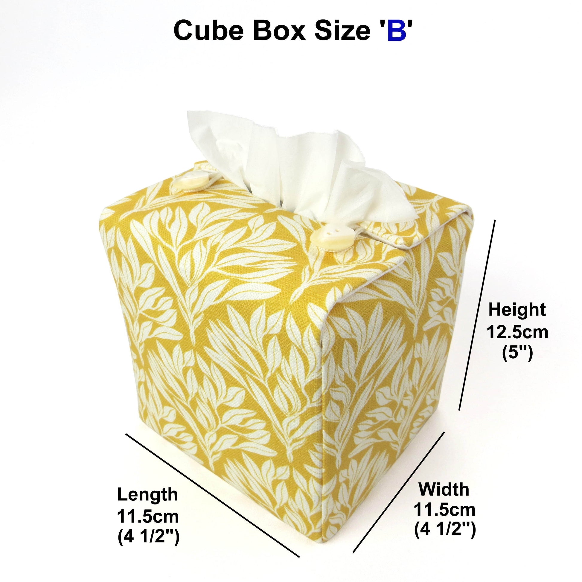 Linen square tissue box cover with an off-white leaf design on a yellow background