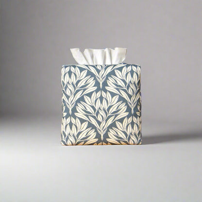 Linen square tissue box cover with an off-white leaf pattern on a blue background