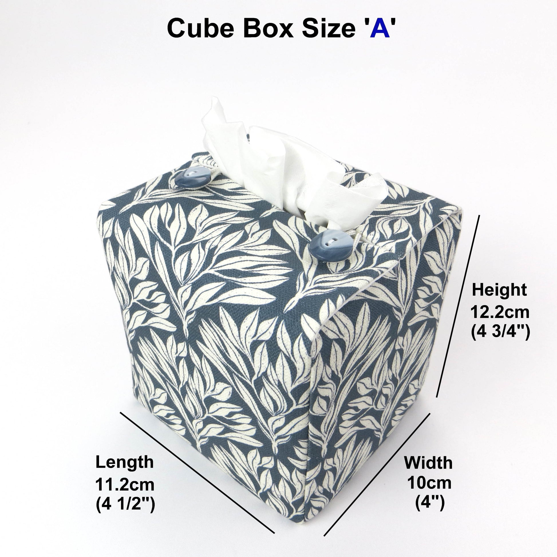 Linen square tissue box cover with an off-white leaf pattern on a blue background