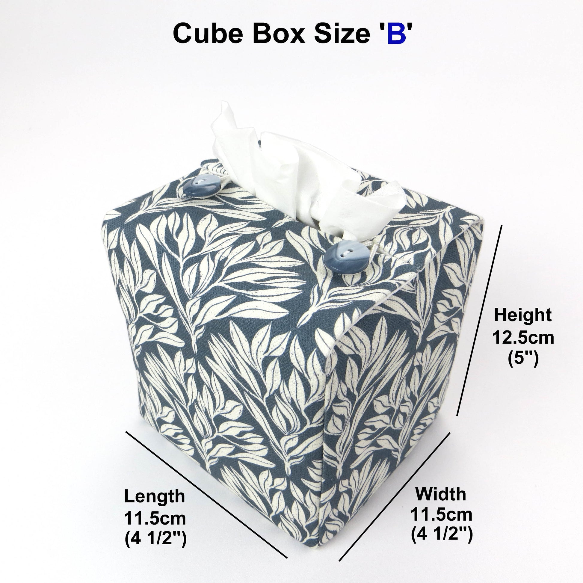 Linen square tissue box cover with an off-white leaf pattern on a blue background