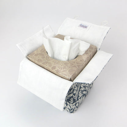Linen square tissue box cover with an off-white leaf pattern on a blue background