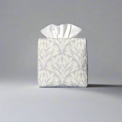 Square linen tissue box cover with off-white leaf design on a light grey background