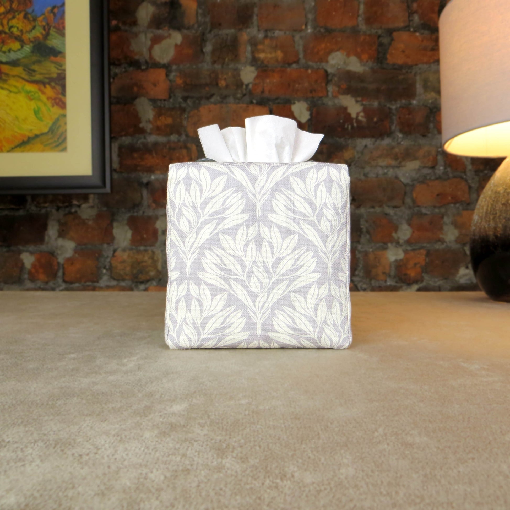Square linen tissue box cover with off-white leaf design on a light grey background