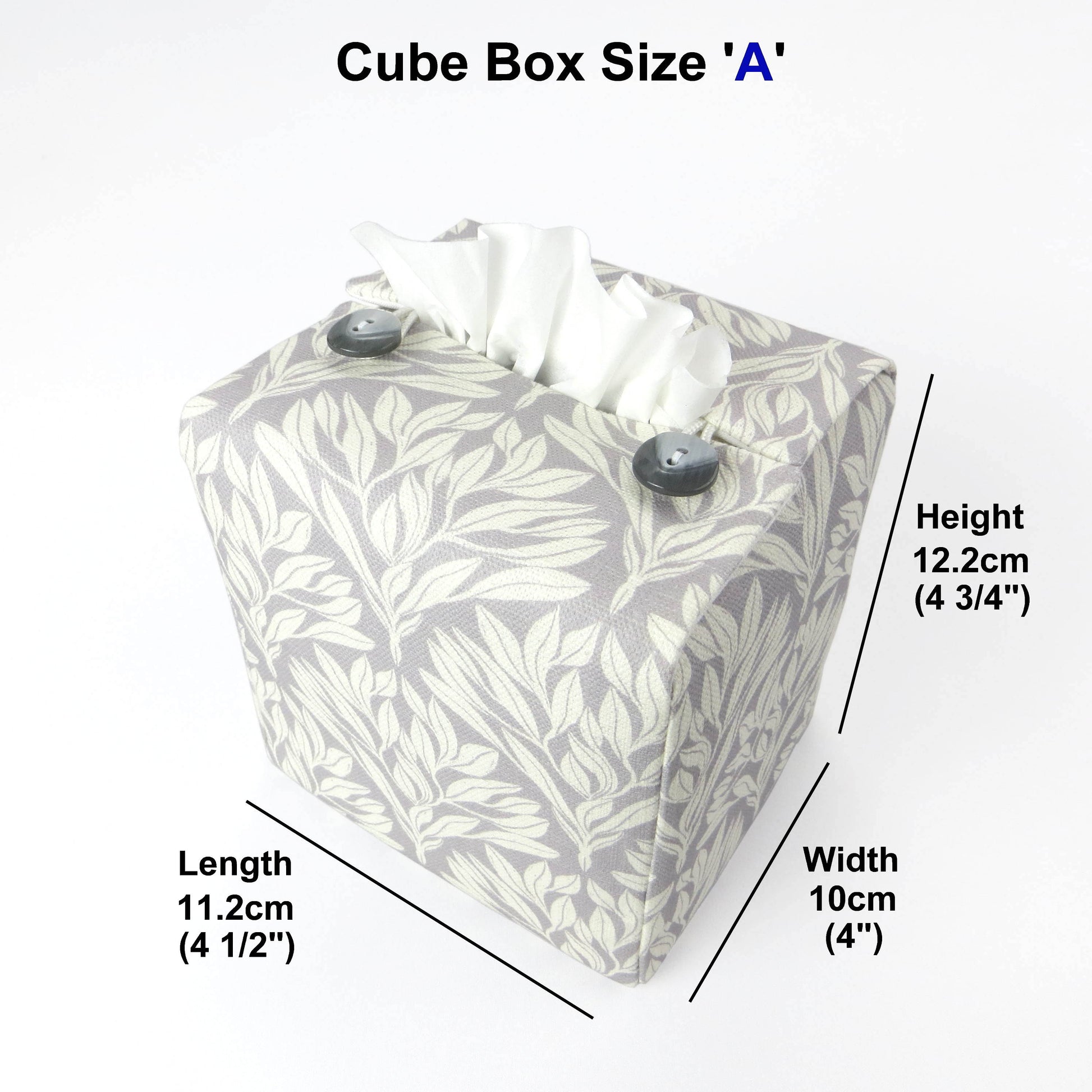 Square linen tissue box cover with off-white leaf design on a light grey background