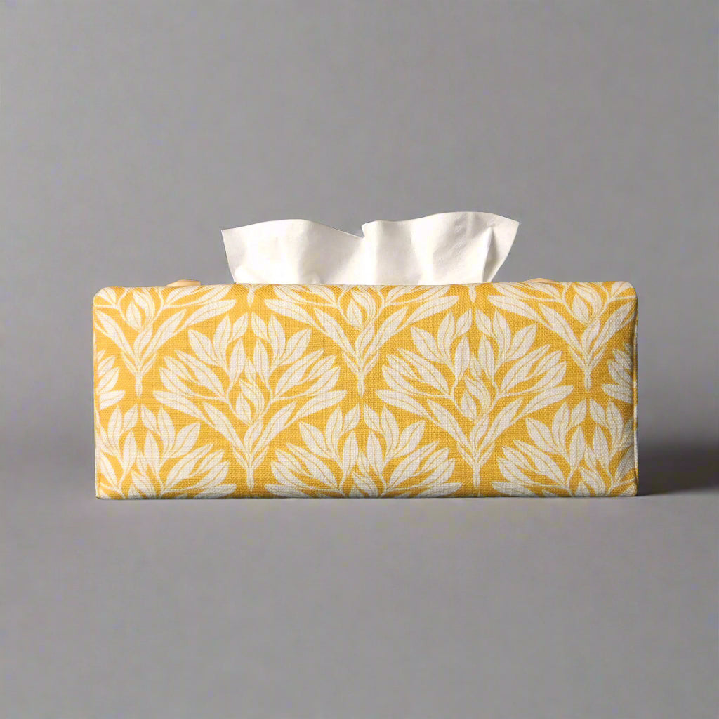 Linen rectangular tissue box cover with an off-white leaf design on a yellow background