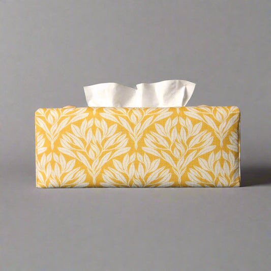 Linen rectangular tissue box cover with an off-white leaf design on a yellow background