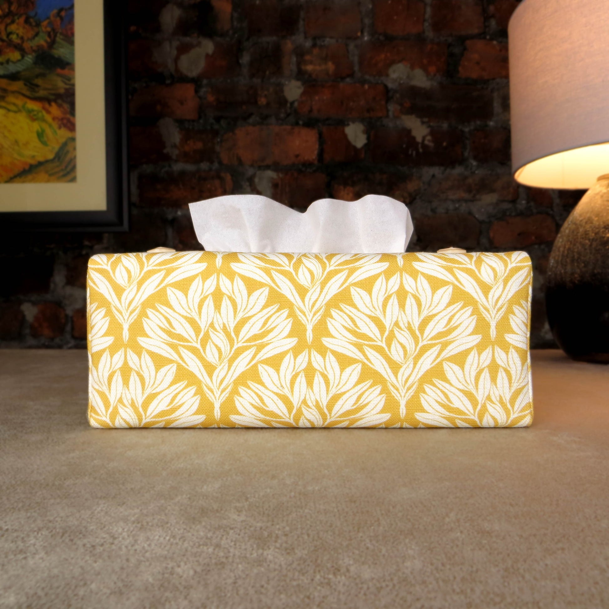 Linen rectangular tissue box cover with an off-white leaf design on a yellow background