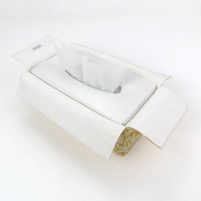 Linen rectangular tissue box cover with an off-white leaf design on a yellow background