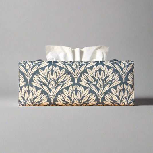 Linen rectangular tissue box cover with an off-white leaf pattern on a blue background