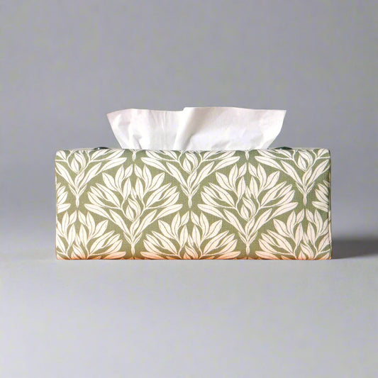 Linen rectangular tissue box cover with an off-white leaf pattern on a sage green background