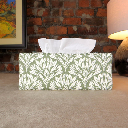 Linen rectangular tissue box cover with an off-white leaf pattern on a sage green background