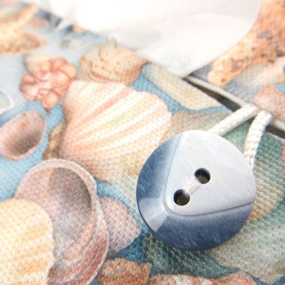 Cotton rectangle tissue box cover with pastel seashells on a soft blue background