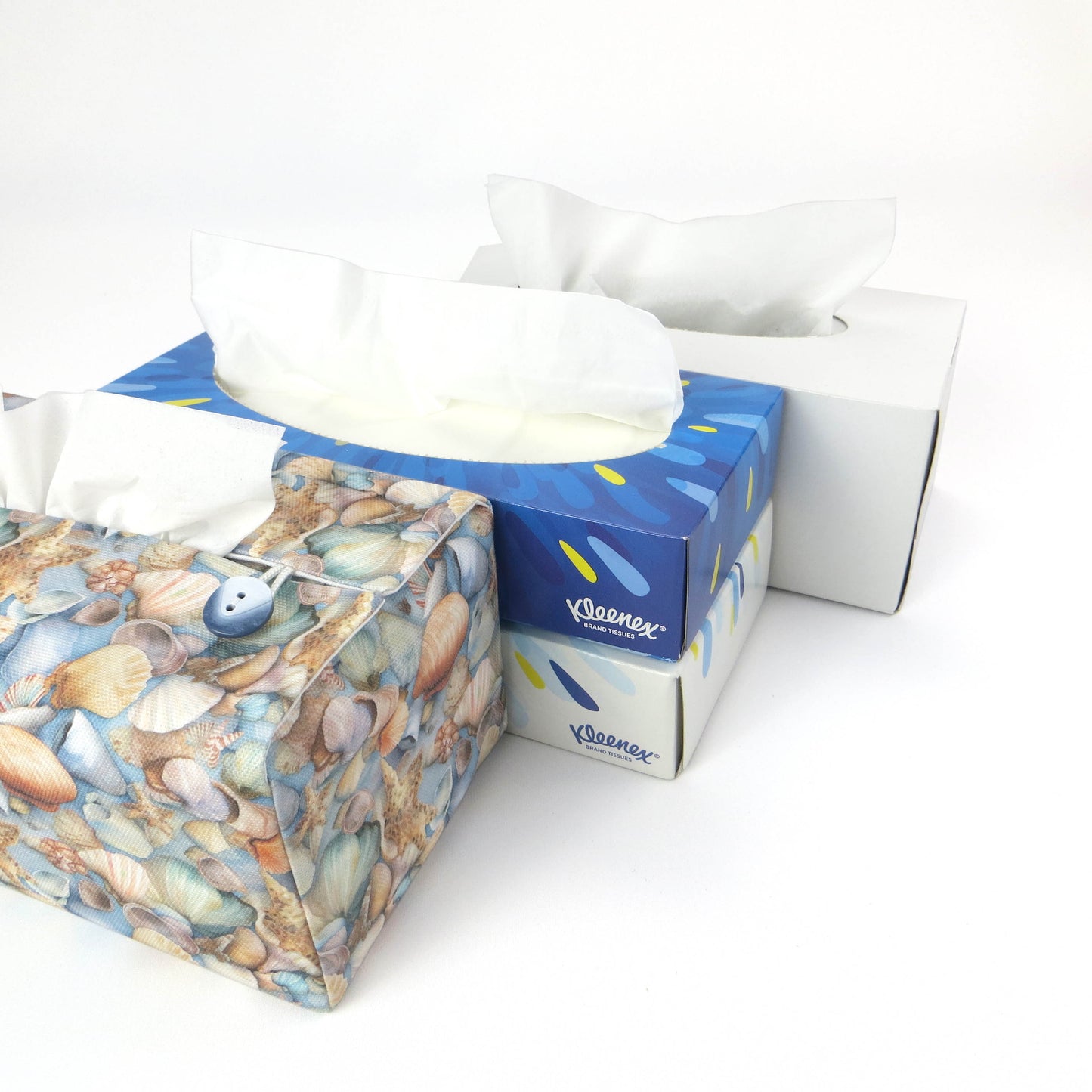 Cotton rectangle tissue box cover with pastel seashells on a soft blue background