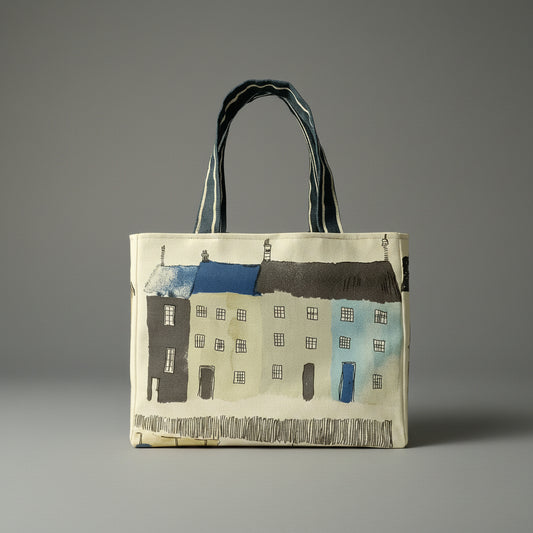 Handmade cotton mini tote bag with seaside houses and beach themed illustrations on an off-white background.