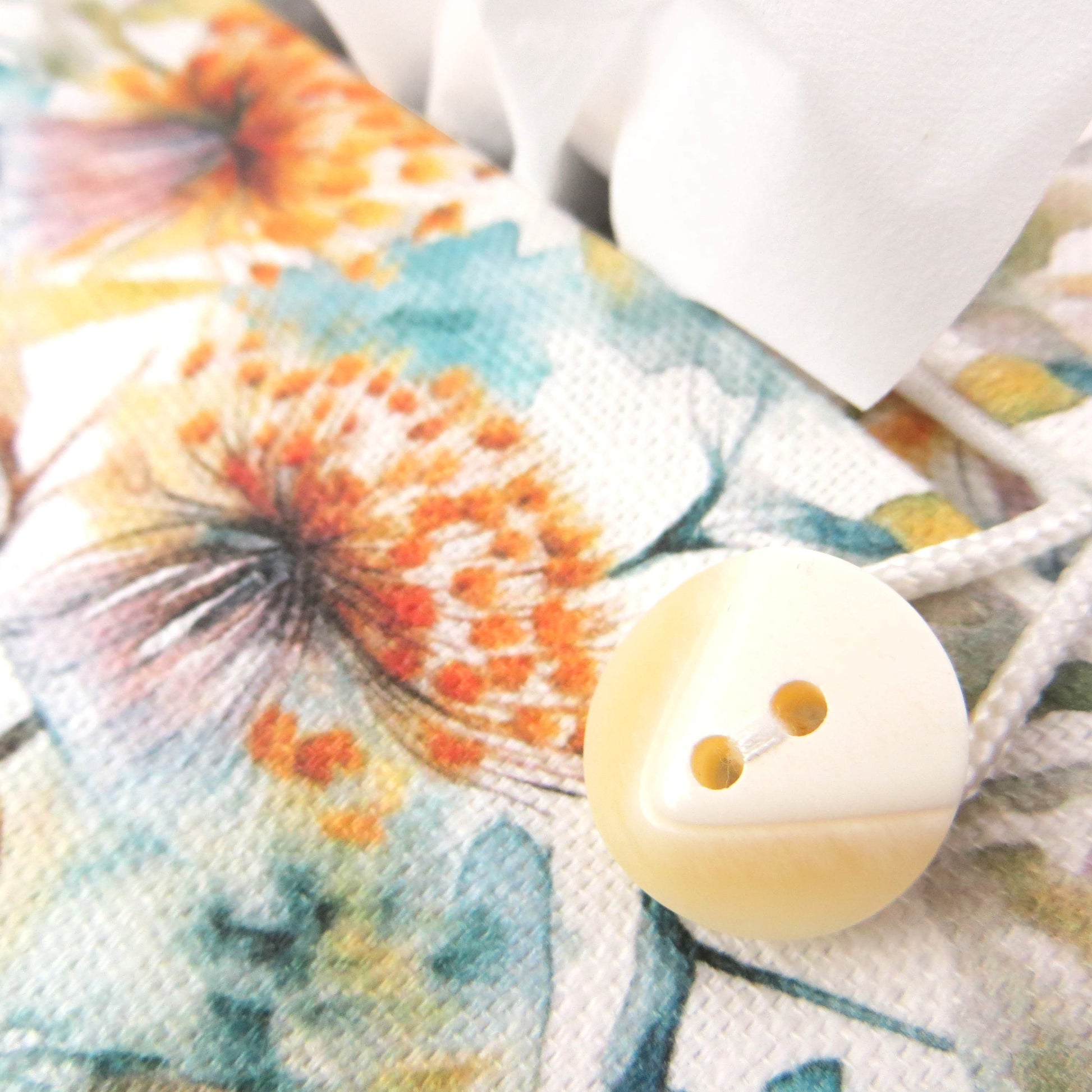 Linen rectangular tissue box cover with watercolour-style dandelion design in yellow and blue