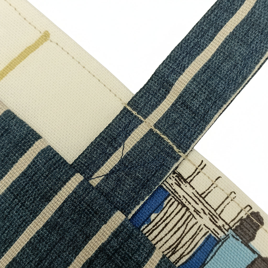 Close up view of a mini tote bag handle, interior, and exterior fabrics.