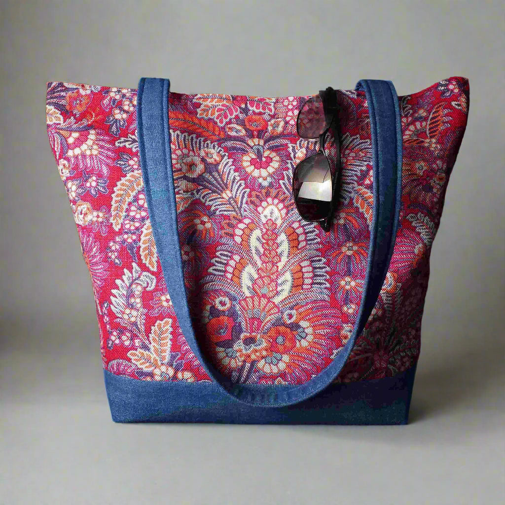Large tote bag with multi-colour floral pattern, solid blue denim colour base
