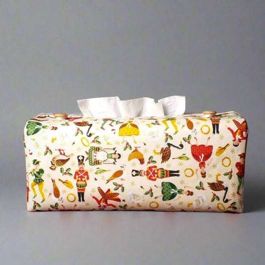 Rectangle tissue box cover with holiday themed 12 days of Christmas icons on cream colour background