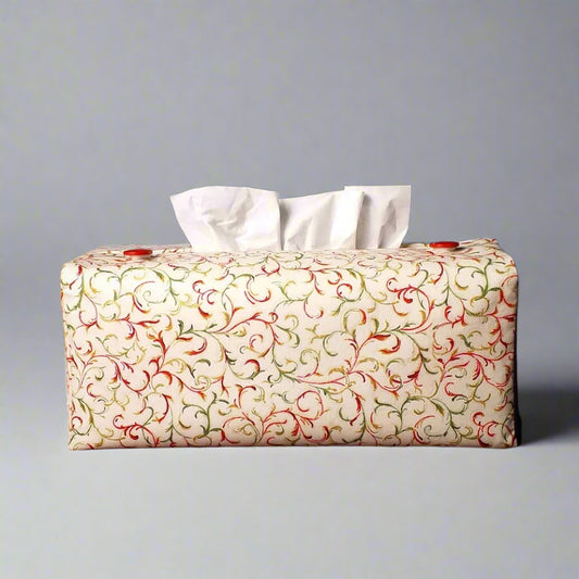 Cotton rectangle tissue box cover  with holiday themed red and green swirls with metallic gold accent on off-white background