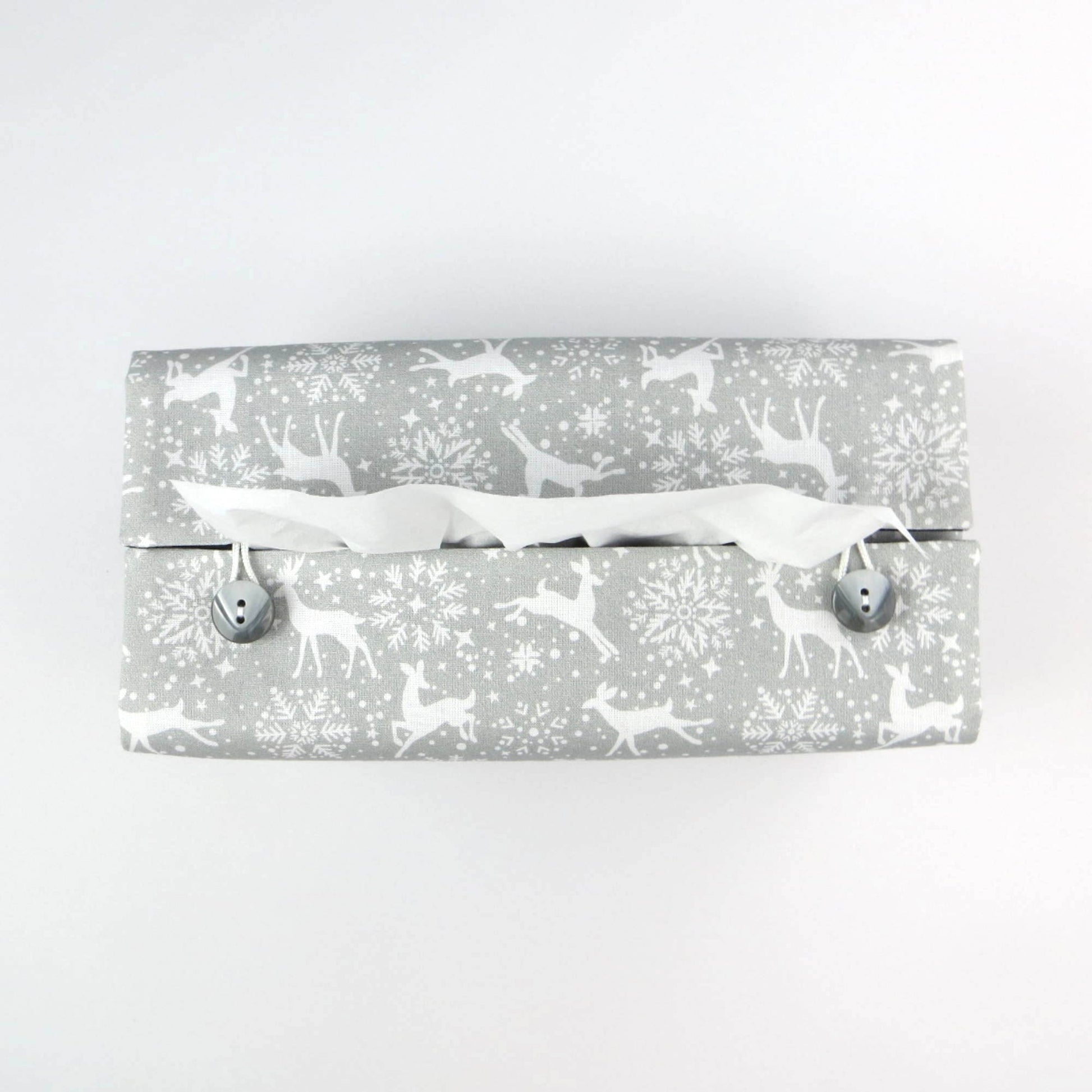 Top view of rectangular tissue box cover with buttons