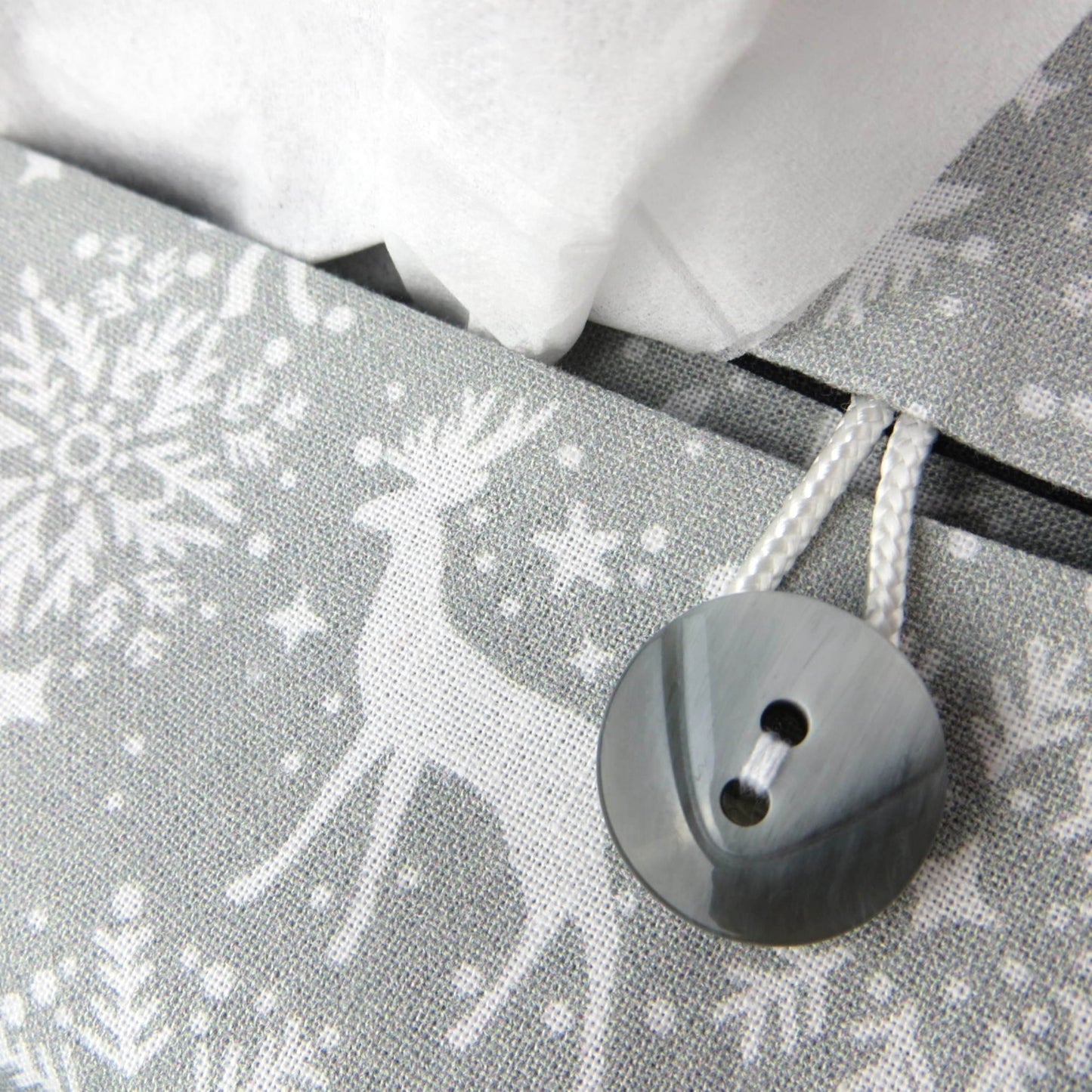 Close up view of rectangular tissue box cover with buttons