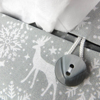 Close up view of rectangular tissue box cover with buttons