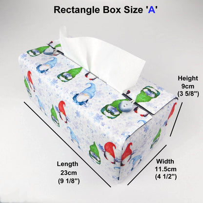 Rectangular tissue box cover with holiday themed red, green, and blue gnomes design on white and blue snowflake pattern background