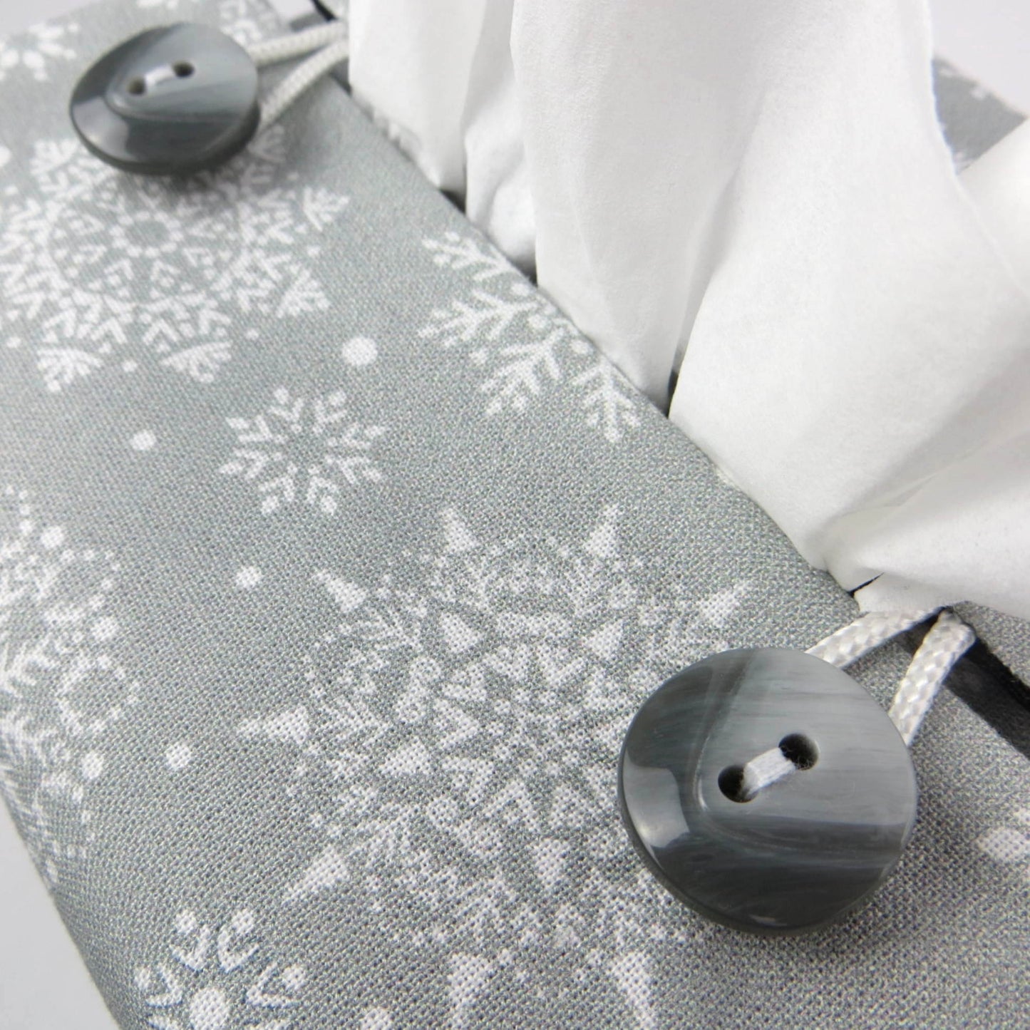 Close up of square tissue box cover with buttons