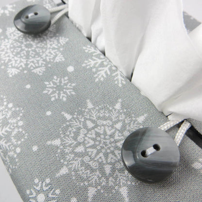 Close up of square tissue box cover with buttons