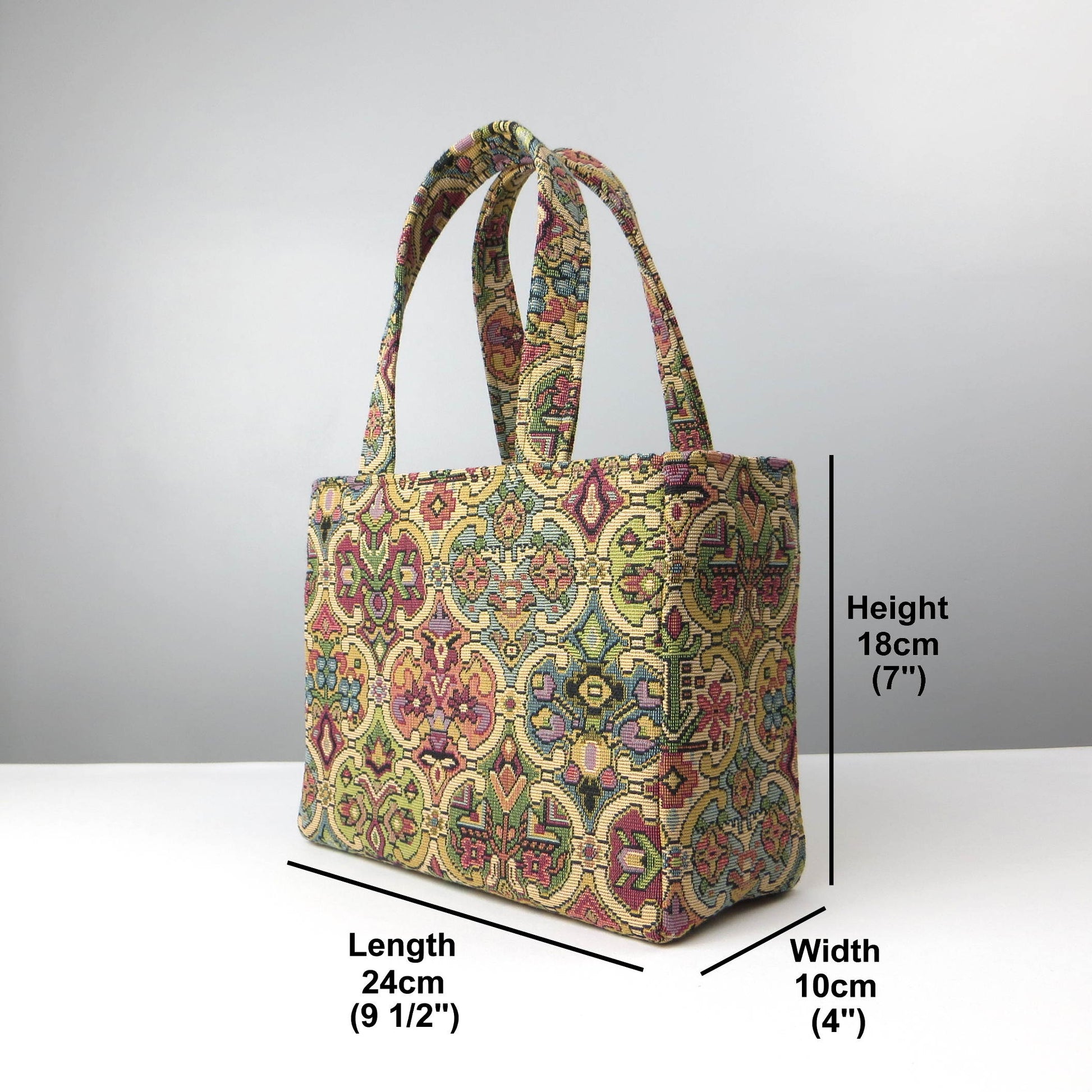 Mini tote bag with multi colour geometric pattern and purple velvet lining