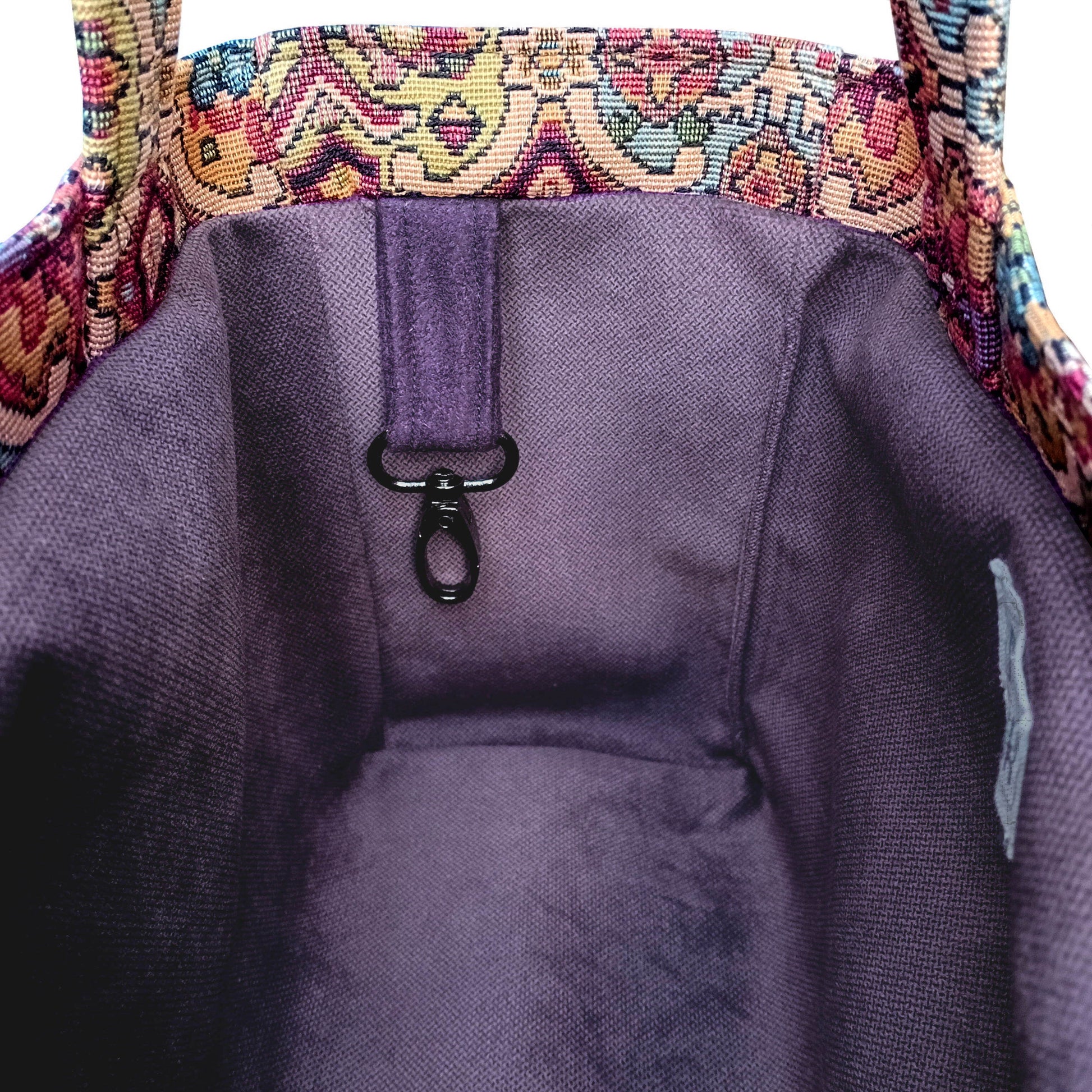 Close up of multi colour motif mini tote bag interior with key clip