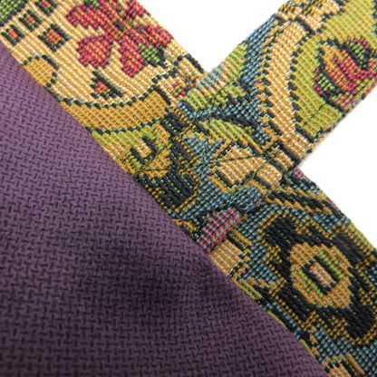 Mini tote bag with multi colour geometric pattern and purple velvet lining