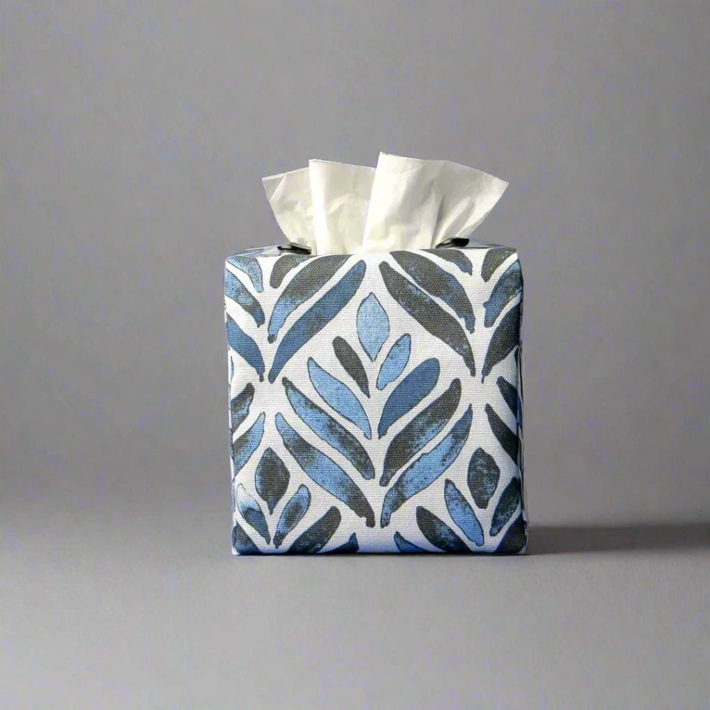 Square tissue box cover with navy blue watercolour style leaf pattern on white background