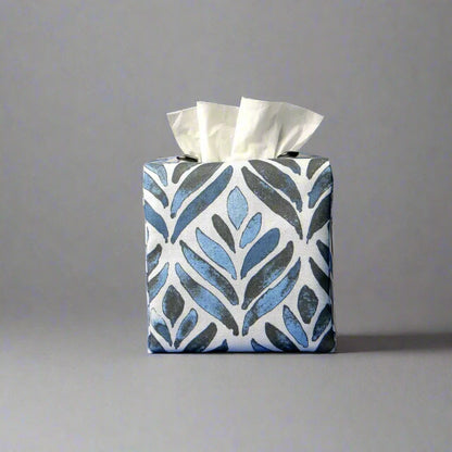 Square tissue box cover with navy blue watercolour style leaf pattern on white background