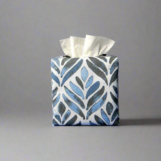 Square tissue box cover with navy blue watercolour style leaf pattern on white background