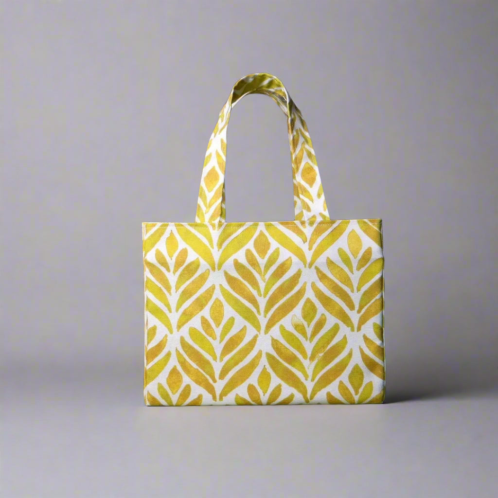Mini tote bag with yellow watercolour style leaf pattern on background